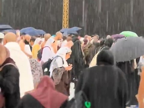 Watch: Pilgrims embrace heavy rain while circling the Kaaba in Mecca