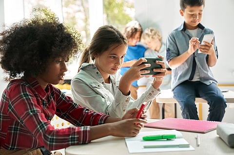 While some parents lean toward a stricter approach, other schools have experimented with solutions that let kids stay connected without creating distractions.