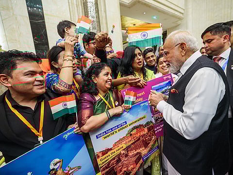 India’s Prime Minister Narendra Modi receives a rousing welcome from the Indian community upon his arrival at a hotel, in Tianjin on Saturday.