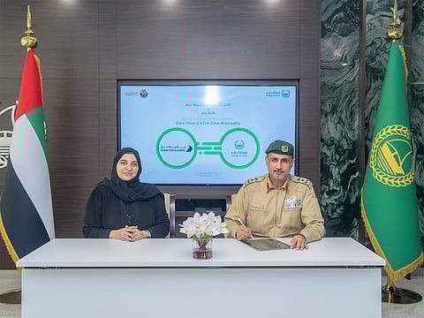 Brigadier Mansour Yusuf Al Qargaoui and Dr. Naseem Mohammed Rafi during the agreement signing.