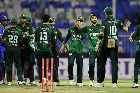 Pakistan players celebrate their comfortable win against Afghanistan in the tri-series opener at Sharjah Stadium on Friday.