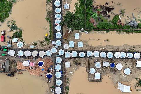 This aerial view shows makeshift shelters built for flood-affected people in Chung, in Pakistan's Punjab province, on August 31, 2025.