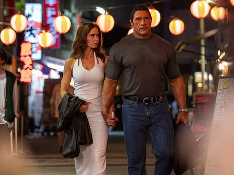 This image released by A24 shows Emily Blunt, left, and Dwayne Johnson in a scene from "The Smashing Machine." (Ken Hirama Dunn/A24 via AP)