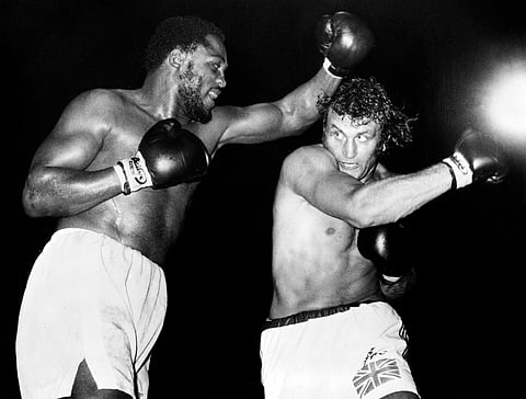 US Heavyweight boxer Joe Frazier (L) and British Heavyweight boxer Joe Bugner (R) fight at Earls Court Arena in London on July 2, 1973.