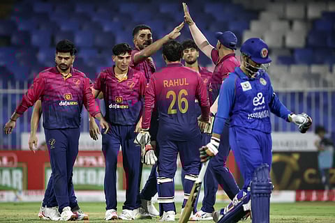 UAE's players celebrate after taking the wicket during the T20 international cricket match against Afghanistan in Sharjah on September 1, 2025.