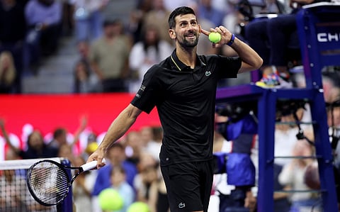 Novak Djokovic of Serbia listens for the loudest cheer before hitting signed balls into the crowd after his straight sets victory against Jan-Lennard Struff of Germany during their Men's Singles Fourth Round match on Day Eight of the 2025 US Open at USTA Billie Jean King National Tennis Center on August 31, 2025 in New York City.