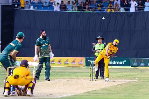 Babar Azam bowling during the exhibition match.