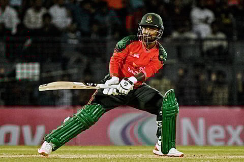 Bangladesh’s captain Litton Das watches the ball after playing a shot during the second 20I against Netherlands at the Sylhet International Cricket Stadium in Sylhet on September 1, 2025.