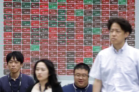 Japan’s Nikkei 225 market index briefly jumped over 5 percent before settling up 4.9 percent at 56,919 points, as of around 9:30 am (0030 GMT) -- the first time it has climbed above 56,000.