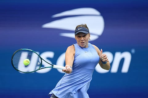 Amanda Anisimova of the United States returns to Iga Swiatek of Poland during the Women's Quarterfinal match.
