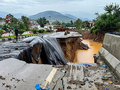 A section of the Jammu–Srinagar National Highway collapsed in Udhampur district on Thursday following continuous rainfall, forcing authorities to suspend vehicular traffic along the vital road link.