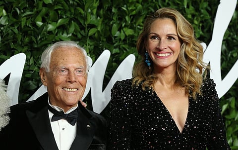 Italian fashion designer Giorgio Armani and US actress Julia Roberts poses on the red carpet upon arrival at The Fashion Awards 2019 in London