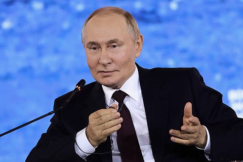 In this photo released by the Roscongress Foundation, Russian President Vladimir Putin gestures as he speaks at the plenary session of the Eastern Economic Forum in Vladivostok, Russia, Friday, Sept. 5, 2025.