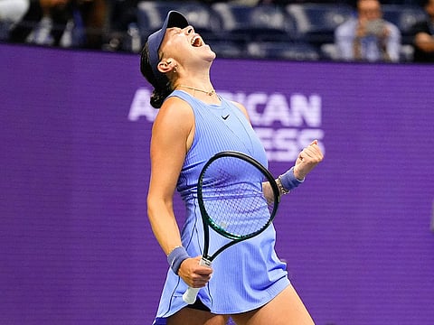 Amanda Anisimova, of the United States, reacts after defeating Naomi Osaka, of Japan, during the women's singles semifinals of the US Open tennis championships, Friday, September 5, 2025, in New York.