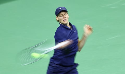 Italy's Jannik Sinner returns the ball to Canada’s Felix Auger-Aliassime during their men's singles semifinal tennis match.