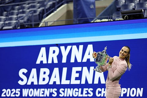 Aryna Sabalenka poses with the championship trophy after defeating Amanda Anisimova of the United States during their Women's Singles Final match on Day Fourteen of the 2025 US Open at USTA Billie Jean King National Tennis Center on September 06, 2025 in the Queens borough of New York City.
