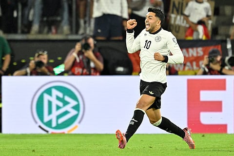 Germany's midfielder Nadiem Amiri celebrates after scoring the 2-1 goal during the 2026 World Cup qualifiers Europe zone group A football match against Northern Ireland on September 7, 2025 in Cologne, western Germany.