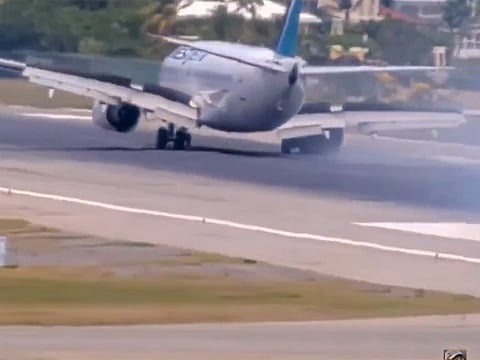 The aircraft was forced to skid along the tarmac on its left main gear, nose gear, and right engine casing.