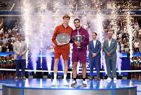 Jannik Sinner of Italy and Carlos Alcaraz of Spain pose following their Men's Singles Final match on Day Fifteen of the 2025 US Open at USTA Billie Jean King National Tennis Center on September 07, 2025 in New York City.