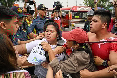 Protesters skirmish with the police as they stage an anti-corruption rally outside the Philippine Department of Public Works and Highways in Navotas, Metro Manila on September 8, 2025.