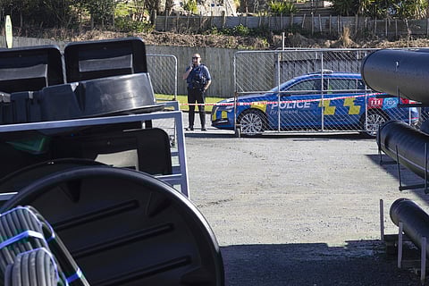 A police officer stands near a hardware store in Piopio in the Waikato district of New Zealand, Monday, Sept. 8, 2025. (Ricky Wilson/Stuff via AP)