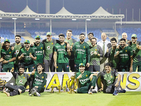 Pakistan's team pose with the trophy after winning the T20 international cricket match against Afghanistan and Pakistan in Sharjah on September 7, 2025.