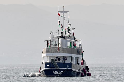 A ship, known as the "Family" and is part of the Global Sumud Flotilla, is anchored off the coast of the village of Sidi Bou Said on September 9, 2025.