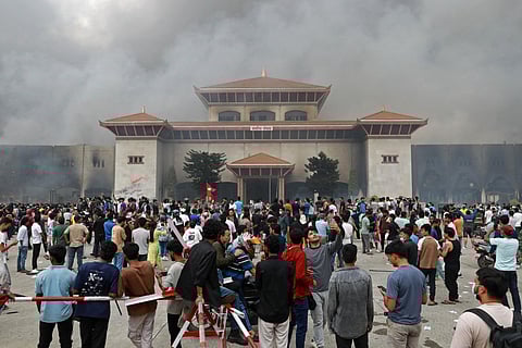 Protesters gather outside the parliament building in Kathmandu.