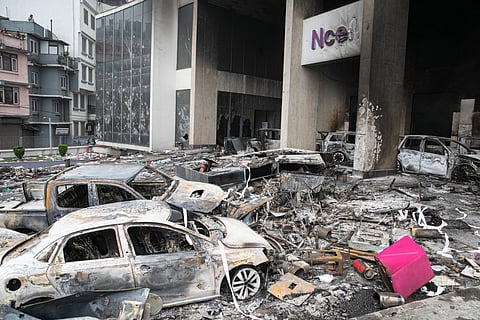A general view shows charred vehicles amid the remains of the torched Ncell headquarter building, Nepal's leading mobile service provider, a day after it was set ablaze by protesters in Kathmandu.