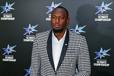 Former Jamaican sprinter Usain Bolt arrives to attend an event celebrating next year’s inaugural Ultimate World Athletics Championship, in Tokyo on September 11, 2025, ahead of the World Athletics Championships.