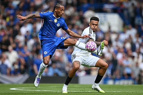 Chelsea's Brazilian striker Joao Pedro (L) vies with Fulham's Brazilian striker Rodrigo Muniz (R) during the English Premier League football match at Stamford Bridge in London on August 30, 2025.