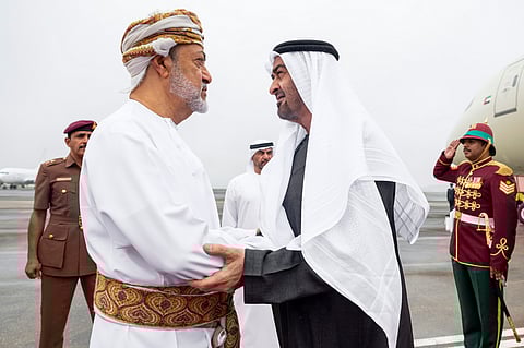 Sheikh Mohamed is received by Sultan Haitham upon arriving at the Royal Flight of Oman.