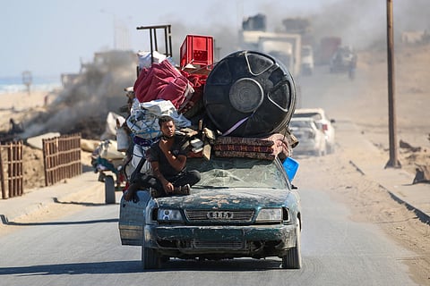 Palestinians transport their belongings as they evacuate Gaza City towards southern areas of the coastal Gaza Strip, on September 11, 2025.