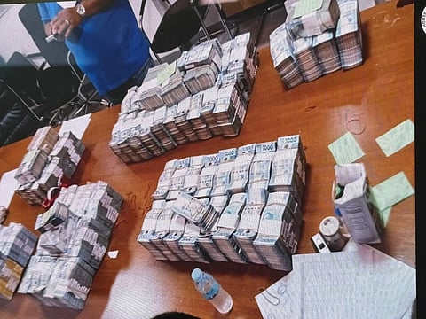 Stacks of cash within the Department of Public Works and Highways (DPWH) Bulacan 1st District Engineering Office compound, revealed by whistleblower Engineer Brice Gonzalez before the House of Representatives on September 9, 2025.