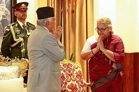 Nepal's President Ram Chandra Paudel (L) gestures after administering the oath to the country's newly appointed Prime Minister Sushila Karki during her swearing-in-ceremony at the President House in Kathmandu.