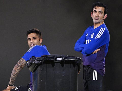 India's captain Suryakumar Yadav (L) and team head coach Gautam Gambhir attend a practice session at the ICC Academy in Dubai on September 13, 2025, on the eve of their Asia Cup 2025 T20 match against Pakistan.