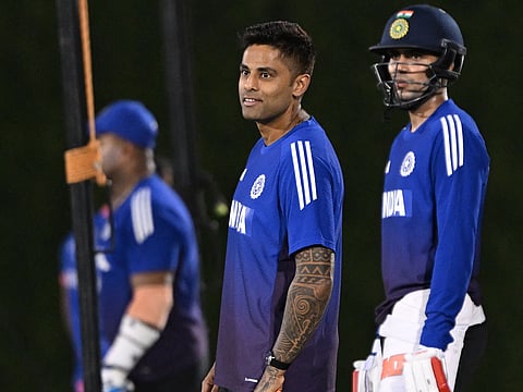 India's captain Suryakumar Yadav (C) and Shubman Gill (R) gesture during a practice session at ICC Academy in Dubai on September 13, 2025, on the eve of their Asia Cup 2025 T20 match against Pakistan.