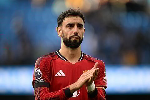 Manchester United's Portuguese midfielder #08 Bruno Fernandes reacts at the end of the English Premier League football match between Manchester City and Manchester United at the Etihad Stadium in Manchester, north west England, on September 14, 2025.