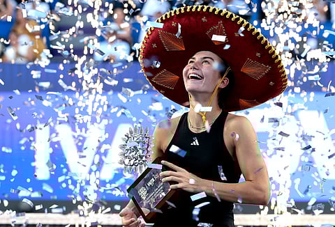 US' Iva Jovic celebrates with the trophy after winning the women's singles final match of the 2025 WTA Guadalajara Open against Colombia's Emiliana Arango in Zapopan, Mexico, on September 14, 2025.