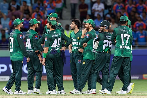 Pakistan team waits for the third umpire’s decision in their DP World Asia Cup match at Dubai International Stadium on Sunday.