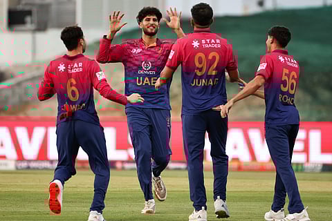 UAE's players celebrate after the dismissal of Oman's captain Jatinder Singh during the Asia Cup 2025 Twenty20 international cricket match between United Arab Emirates and Oman at the Sheikh Zayed Cricket Stadium in Abu Dhabi on September 15, 2025.