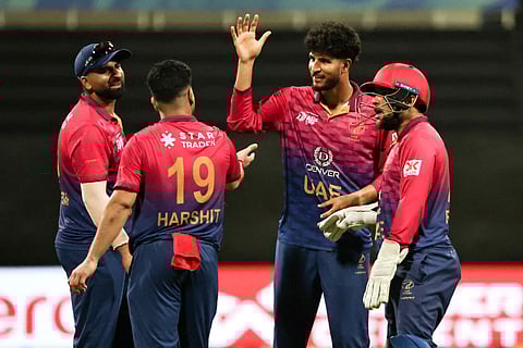 UAE's players celebrate after the dismissal of Oman's Aryan Bisht during the Asia Cup 2025 Twenty20 international cricket match at the Sheikh Zayed Cricket Stadium in Abu Dhabi on September 15, 2025.