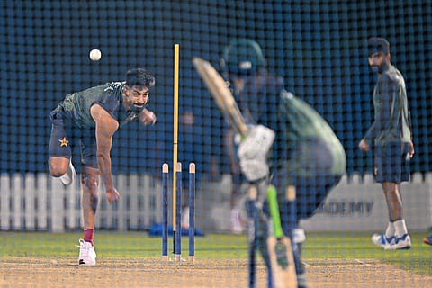 Pakistan's Haris Rauf (L) bowls during a practice session at the International Cricket Council (ICC) Academy in Dubai on September 16, 2025, ahead of their Asia Cup 2025 Twenty20 international cricket match against the UAE.