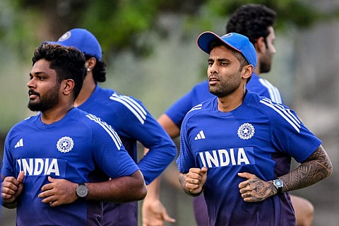 India's captain Suryakumar Yadav (R) and Sanju Samson attend a practice session at the International Cricket Council (ICC) Academy in Dubai on September 16, 2025.