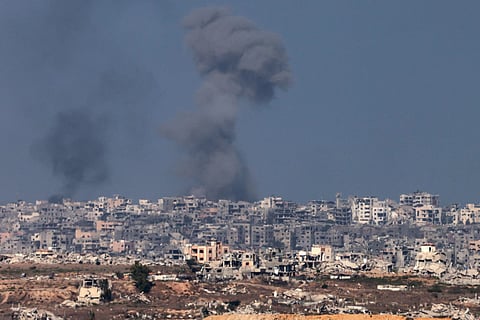 This picture taken from a position at Israel's border with the Gaza Strip shows smoke billowing amid Israeli bombardment of the besieged Palestinian territory on September 16, 2025.