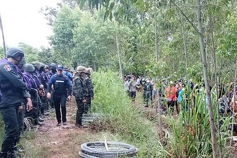 This handout photo taken and released by the Royal Thai Army on September 17, 2025 shows Thai Border Patrol Police (BPP) and police facing Cambodian people in a disputed area along the Cambodia-Thailand border in Sa Kaeo province.