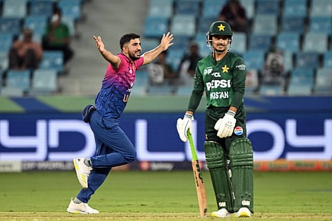 UAE's Junaid Siddique (left) celebrates after taking the wicket of Pakistan's Saim Ayub during the Asia Cup 2025 Twenty20 international cricket match at the Dubai International Stadium in Dubai on September 17, 2025.