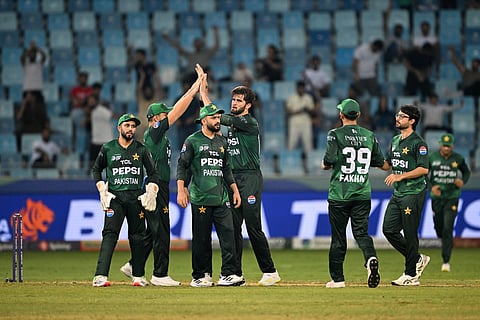 Pakistan's Shaheen Shah Afridi (C) celebrates with teammates after taking the wicket of UAE's Alishan Sharafu during the Asia Cup 2025 Twenty20 international cricket match at the Dubai International Stadium in Dubai on September 17, 2025.