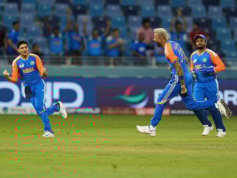 India's Hardik Pandya, centre, celebrates the dismissal of Pakistan's Saim Ayub during their Asia Cup cricket match at Dubai International Cricket Stadium in Dubai, on Sunday, September 14, 2025.
