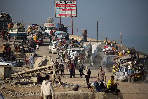 Displaced Palestinians move with their belongings southwards on a road in the Nuseirat refugee camp area in the central Gaza Strip following renewed Israeli evacuation orders for Gaza City.